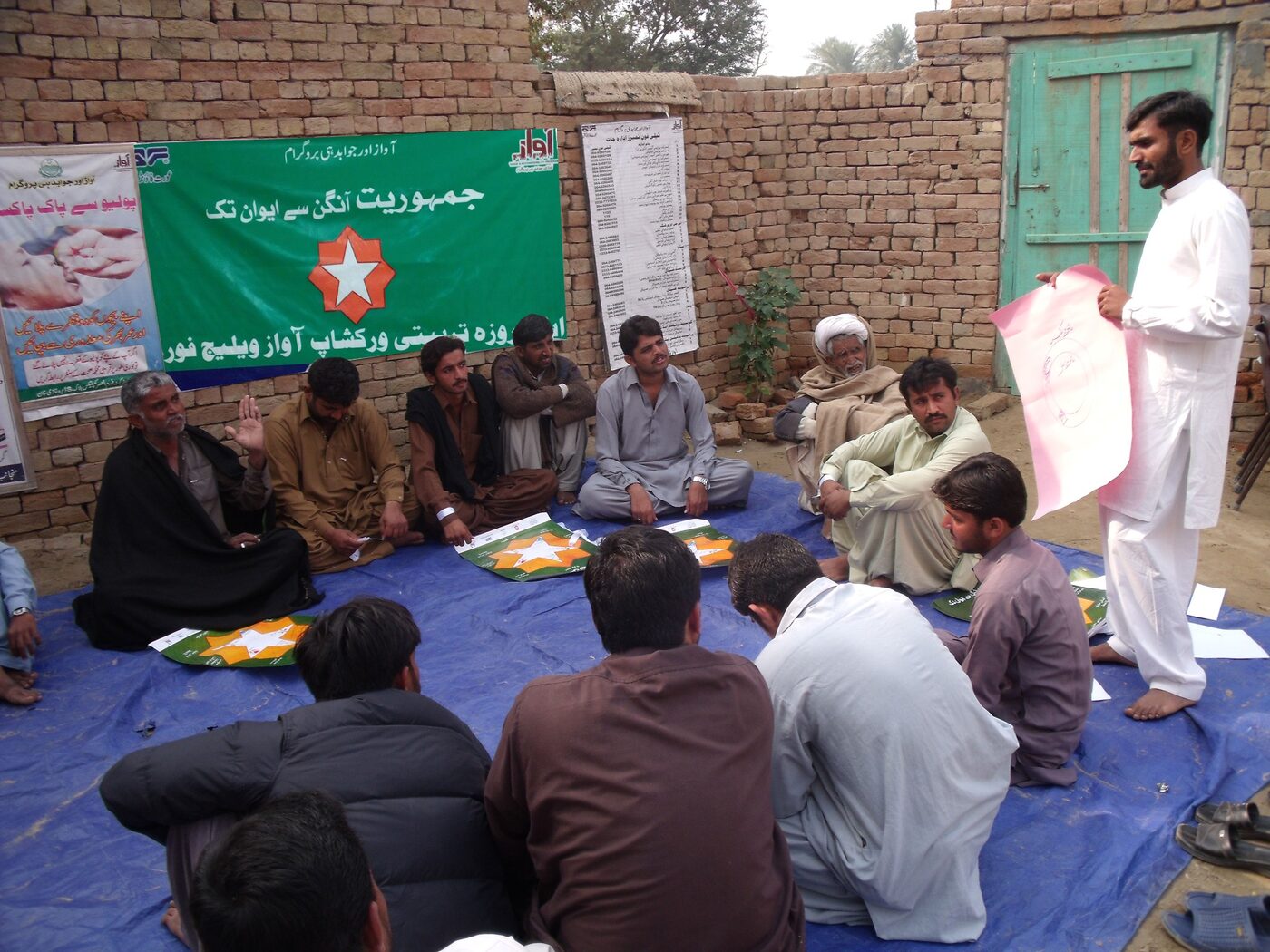 Community members attending an outdoor awareness session