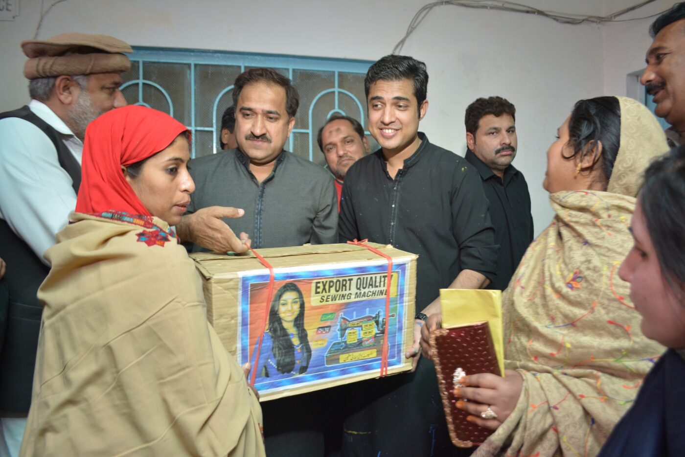 A participant receiving a learning kit