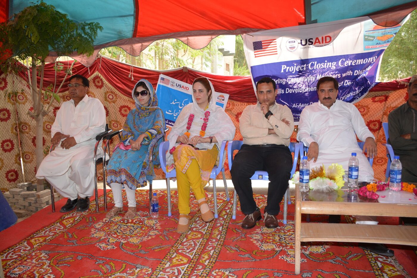 Guests at an education project closing ceremony