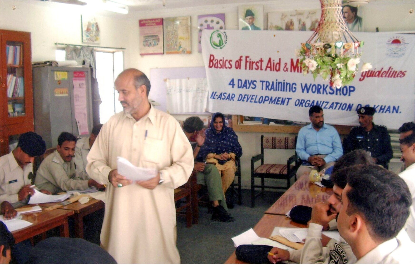 Facilitator addressing participants at a Paiman health workshop